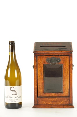 Lot 734 - A LATE 19TH CENTURY OAK LETTER BOX