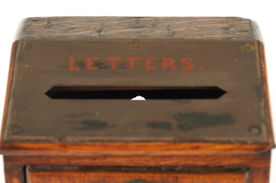 Lot 734 - A LATE 19TH CENTURY OAK LETTER BOX
