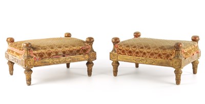 Lot A PAIR OF EARLY 19TH CENTURY CARVED GILT WOOD FOOT STOOLS