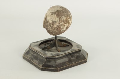 Lot 341 - AN EARLY CARVED STONE HEAD UNDER GLASS DOME