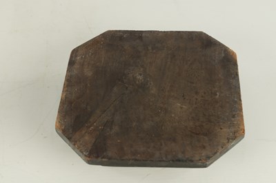 Lot 341 - AN EARLY CARVED STONE HEAD UNDER GLASS DOME
