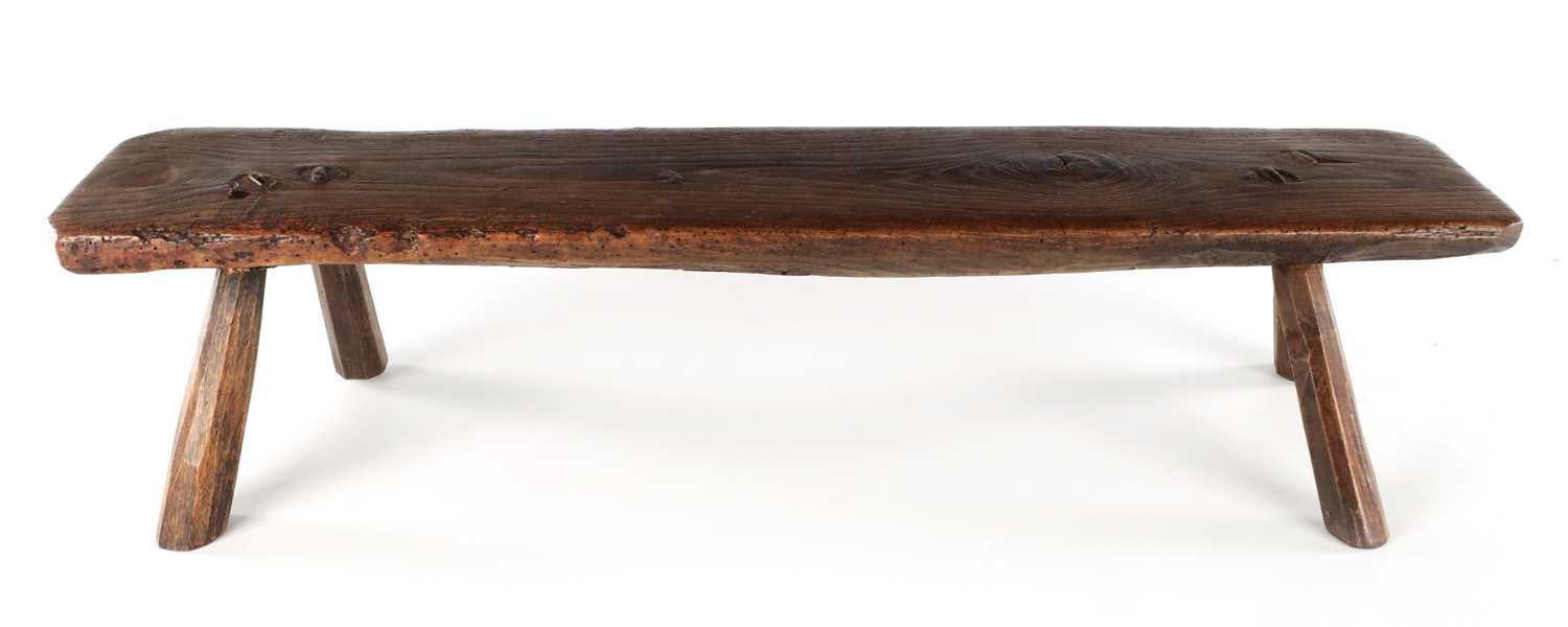 Lot 315 - A 19TH CENTURY ELM LOW STOOL