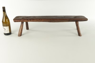 Lot 315 - A 19TH CENTURY ELM LOW STOOL