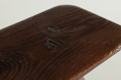 Lot 315 - A 19TH CENTURY ELM LOW STOOL