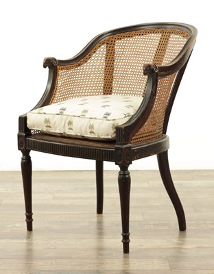 Lot AN EDWARDIAN MAHOGANY ADAM STYLE BERGERE CHAIR