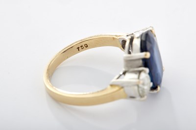 Lot 248 - A 20TH CENTURY 18CT GOLD SAPPHIRE AND DIAMOND THREE-STONE RING