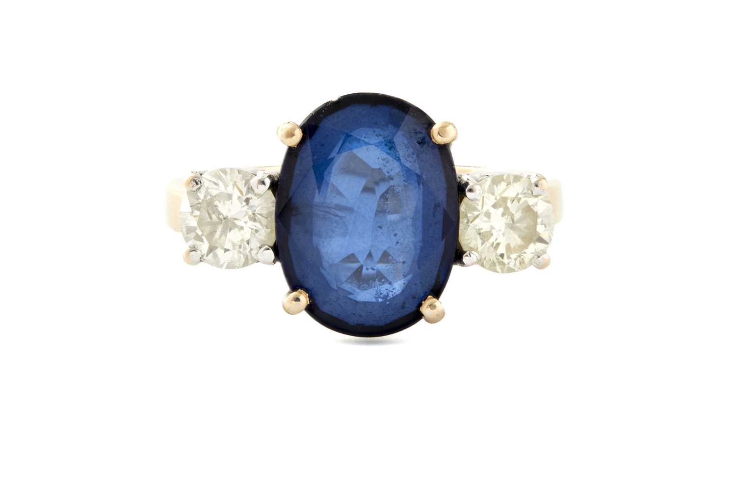 Lot 248 - A 20TH CENTURY 18CT GOLD SAPPHIRE AND DIAMOND THREE-STONE RING