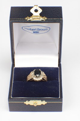 Lot 287 - A 9CT GOLD SAPPHIRE AND DIAMOND HALO RING