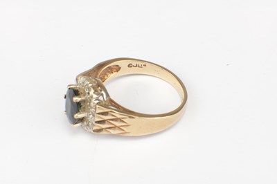 Lot 287 - A 9CT GOLD SAPPHIRE AND DIAMOND HALO RING