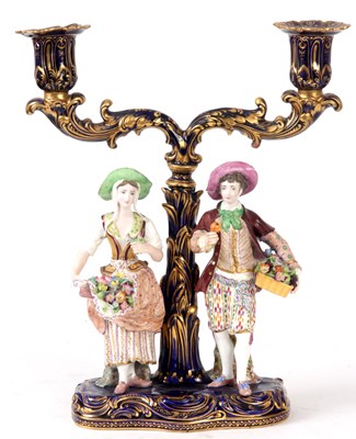 Lot 41 - A 19TH CENTURY MINTON TWO BRANCH CANDELABRA on...