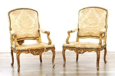 Lot A FINE PAIR OF 18TH CENTURY GILT CARVED WOOD UPHOLSTERED ARMCHAIRS