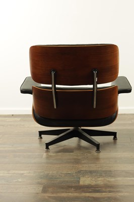 Lot 1269 - CHARLES AND RAY EAMES. A 1970's LEATHER UPHOLSTERED LOUNGE CHAIR AND OTTOMAN