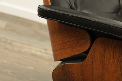 Lot 1269 - CHARLES AND RAY EAMES. A 1970's LEATHER UPHOLSTERED LOUNGE CHAIR AND OTTOMAN