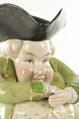 Lot 41 - AN EARLY 19TH CENTURY STAFFORDSHIRE TOBY JUG