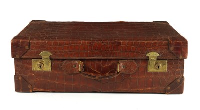 Lot A LARGE CROCODILE SKIN SUITCASE CIRCA 1900