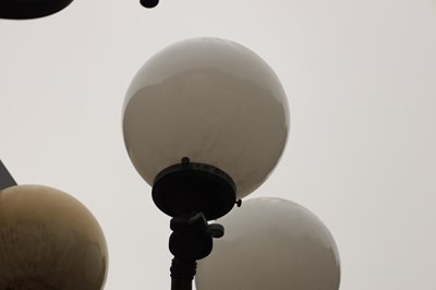 Lot 644 - A RARE PAIR OF EARLY 20TH CENTURY BRONZE COUNTRY HOUSE LAMP POSTS