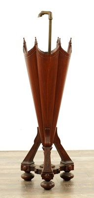 Lot A LATE 19TH CENTURY WALNUT AND BRASS UMBRELLA STAND