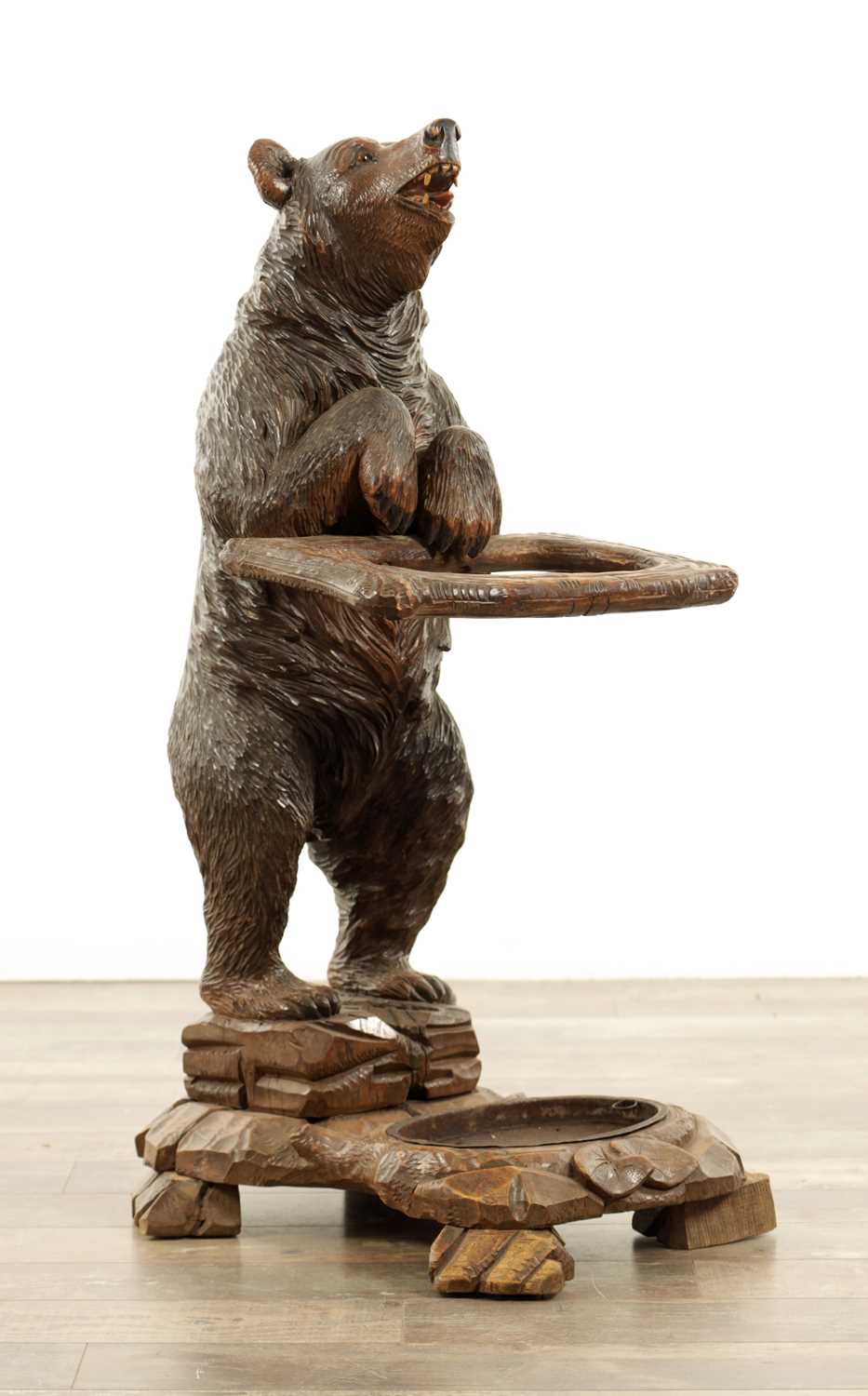 Lot 711 - A LATE 19TH CENTURY BLACK FOREST CARVED BEAR STICK STAND