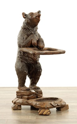 Lot A LATE 19TH CENTURY BLACK FOREST CARVED BEAR STICK STAND