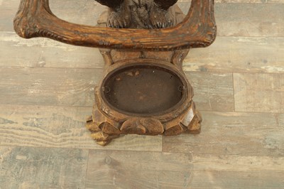 Lot 711 - A LATE 19TH CENTURY BLACK FOREST CARVED BEAR STICK STAND