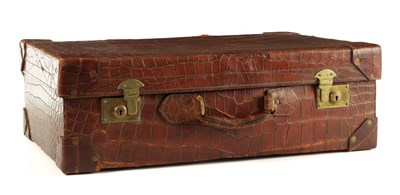 Lot 658 - A CROCODILE SKIN SUITCASE CIRCA 1900