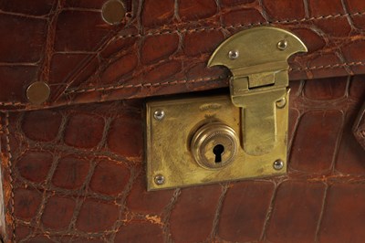 Lot 658 - A CROCODILE SKIN SUITCASE CIRCA 1900