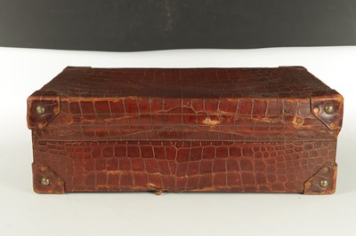Lot 658 - A CROCODILE SKIN SUITCASE CIRCA 1900