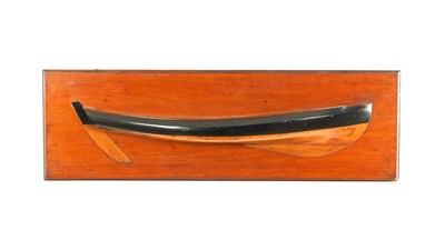 Lot 534 - A 19TH CENTURY PINE HALF HULL MODEL OF A SHIP ON MAHOGANY BOARD