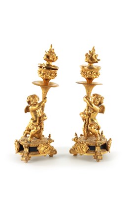 Lot 507 - A PAIR OF 19TH/20TH CENTURY FRENCH GILT BRONZE CANDLESTICKS
