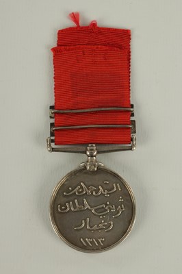 Lot 490 - A 1896 SULTAN OF ZANZIBAR'S MEDAL WITH TWO CLASPS ON CRIMSON RIBBON