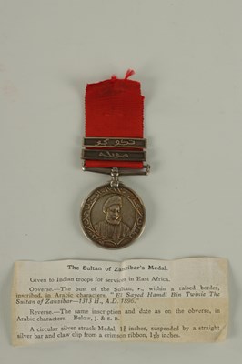 Lot 490 - A 1896 SULTAN OF ZANZIBAR'S MEDAL WITH TWO CLASPS ON CRIMSON RIBBON