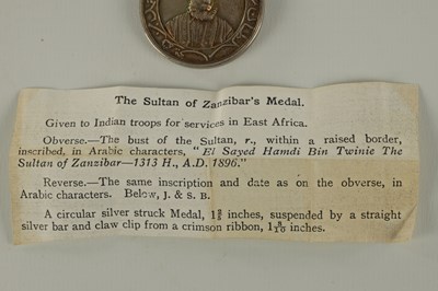 Lot 490 - A 1896 SULTAN OF ZANZIBAR'S MEDAL WITH TWO CLASPS ON CRIMSON RIBBON