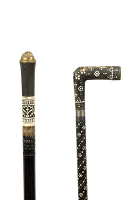 Lot 812 - TWO INDIAN CARVED HORN, HARDWOOD AND BONE INLAID WALKING STICKS