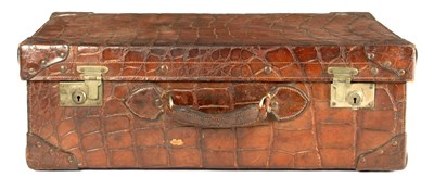 Lot 530 - A CROCODILE SKIN SUITCASE CIRCA 1900