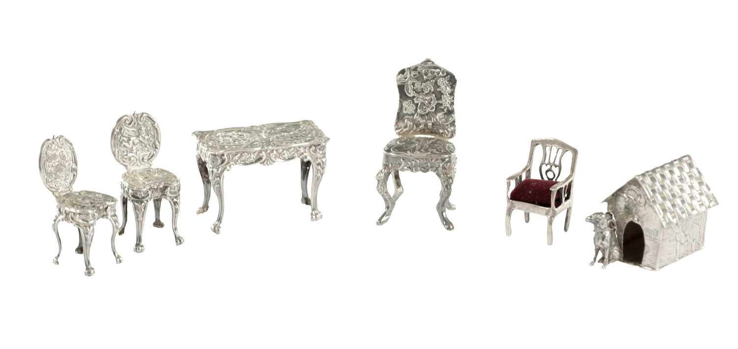 254 - A COLLECTION OF CONTINENTAL SILVER MINIATURE FURNITURE