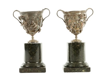 Lot 634 - A PAIR OF ELKINGTON EARLY 19TH CENTURY SILVER-PLATED URNS