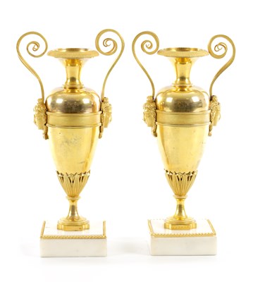 Lot 576 - A PAIR OF EARLY 19TH CENTURY FRENCH ORMOLU AND WHITE MARBLE URNS
