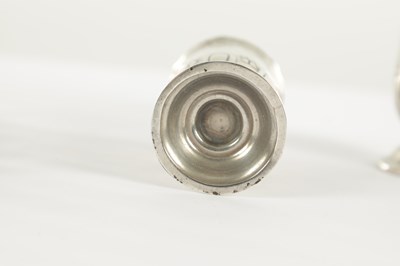 Lot 4 - A PAIR OF SMALL SILVER TOAST RACKS TOGETHER WITH A PAIR OF SILVER PEPPERETTES