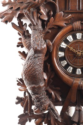Lot 1027 - A LARGE LATE 19TH CENTURY MUSICAL BLACK FOREST CUCKOO WALL CLOCK