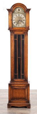 Lot 126 - AN EDWARDIAN OAK CASED GRANDMOTHER CLOCK
