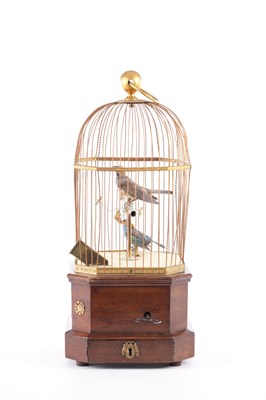 Lot 537 - A LATE 19TH CENTURY COIN-OPERATED WALNUT CASED SINGING BIRD AUTOMATON