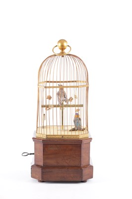 Lot 537 - A LATE 19TH CENTURY COIN-OPERATED WALNUT CASED SINGING BIRD AUTOMATON