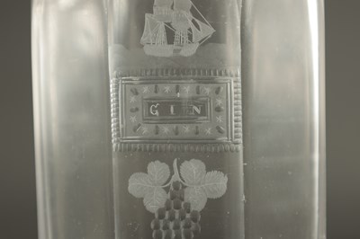 Lot 373 - A SET OF THREE GEORGIAN CUT GLASS DECANTERS