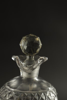 Lot 373 - A SET OF THREE GEORGIAN CUT GLASS DECANTERS