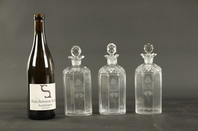 Lot 373 - A SET OF THREE GEORGIAN CUT GLASS DECANTERS