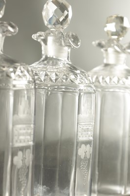Lot 373 - A SET OF THREE GEORGIAN CUT GLASS DECANTERS