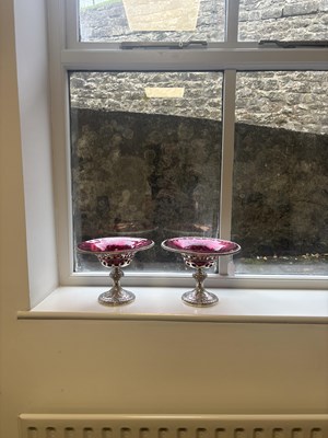 Lot 458 - JOHN SAMUEL HUNT, LONDON. A PAIR OF VICTORIAN SILVER AND RUBY GLASS TAZZAS