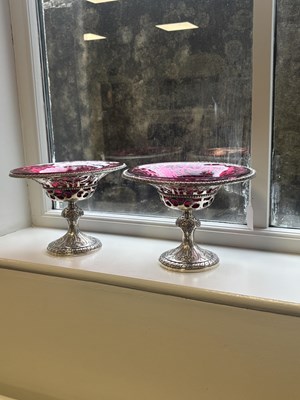 Lot 458 - JOHN SAMUEL HUNT, LONDON. A PAIR OF VICTORIAN SILVER AND RUBY GLASS TAZZAS