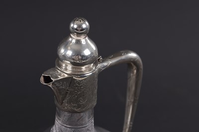Lot 452 - SPURRIER & CO, BIRMINGHAM. A SILVER MOUNTED CUT GLASS CLARET JUG