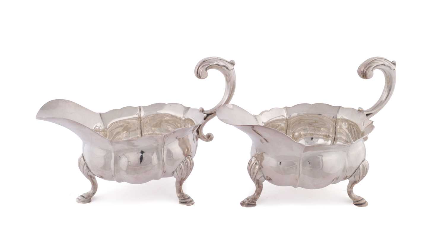 Lot 395 - JOHN POLLOCK, LONDON. A PAIR OF GEORGE III SILVER GRAVY BOATS